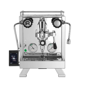 A silver Rocket Espresso Cinquantotto espresso machine with dual boilers, a touch screen communication pod, and a brass grouphead.
